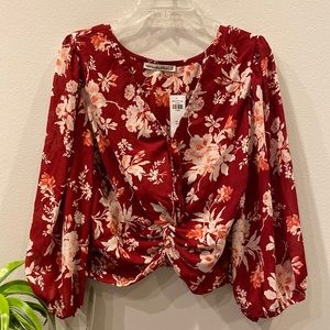 Burgundy floral knot front blouse with ruching at back hem